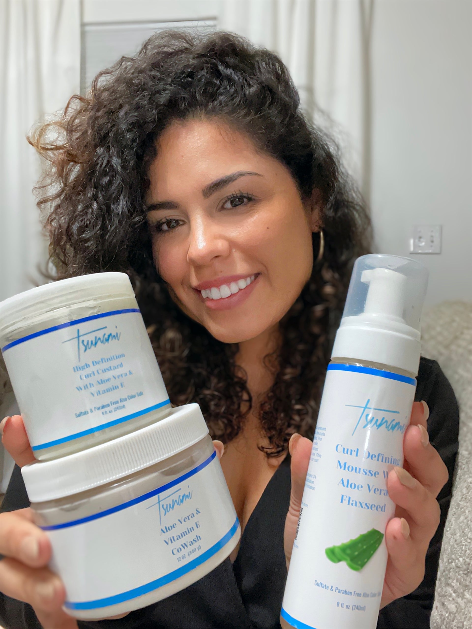 Load video: Unlock the secret to effortless waves with our Tsunami Curly Hair products! 🌊💁‍♀️ Dive into a world of definition and hydration with our leave-in conditioner, co-wash, and curl custard. Embrace your natural curls like never before! #TsunamiCurls #HairCareMagic